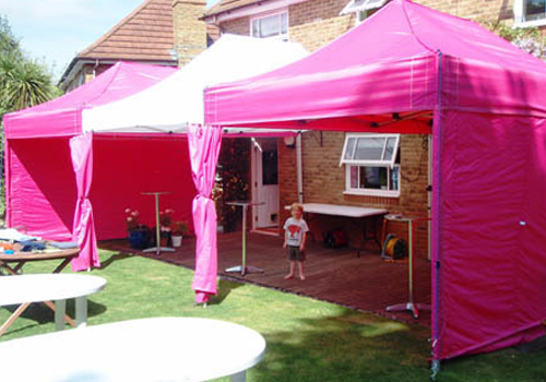 Pink and White Mix Marquees on Decking with Poseur Tables