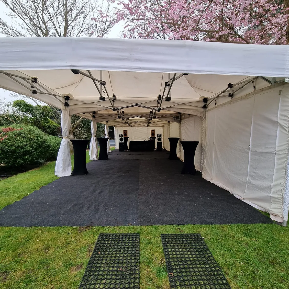 4.5m x 12m Marquee, with flooring, poseur tables and festoon lighting