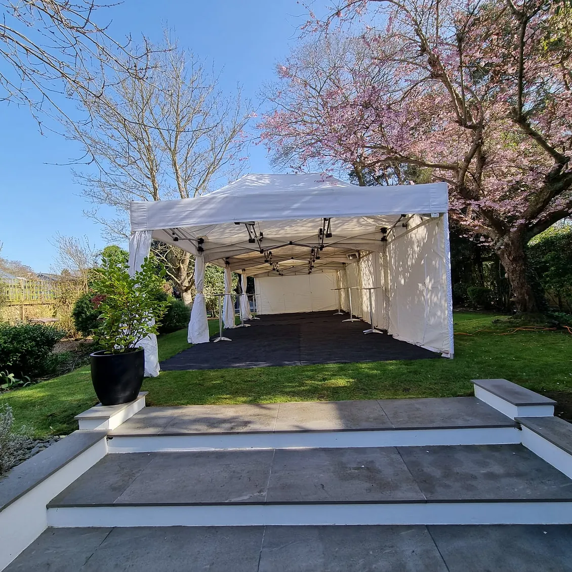white party tent with flooring