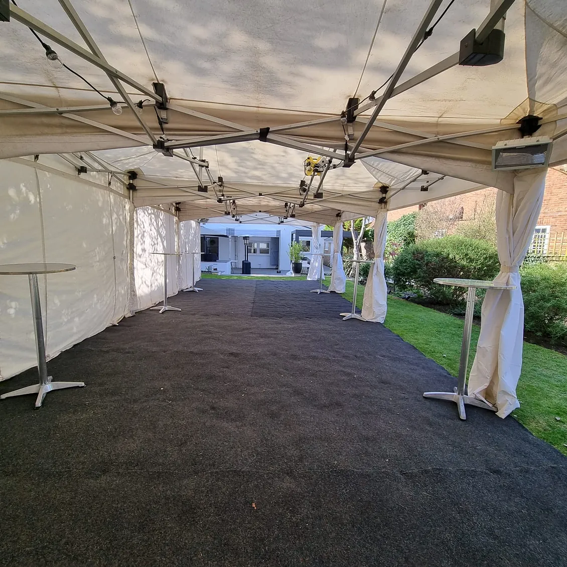 4.5m x 12m Marquee, with flooring, poseur tables and festoon lighting