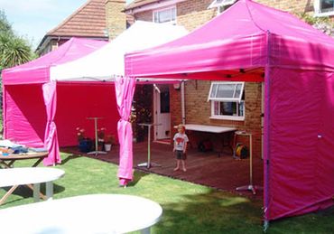 Pink and White Mix Marquees on Decking with Poseur Tables