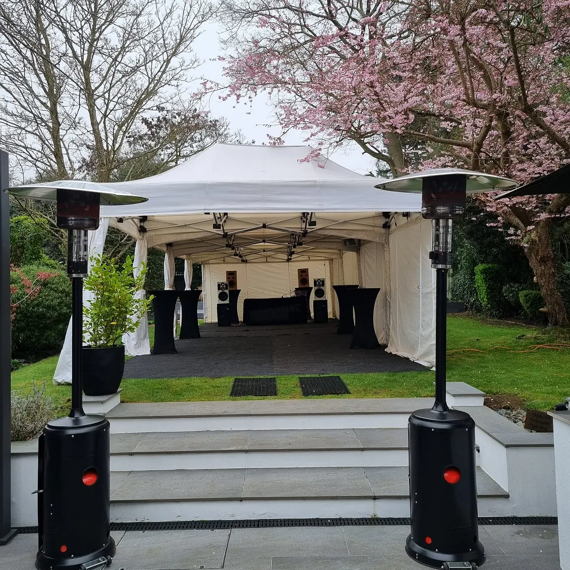 4.5m x 12m Marquee, with flooring, poseur tables and festoon lighting